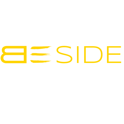 beside